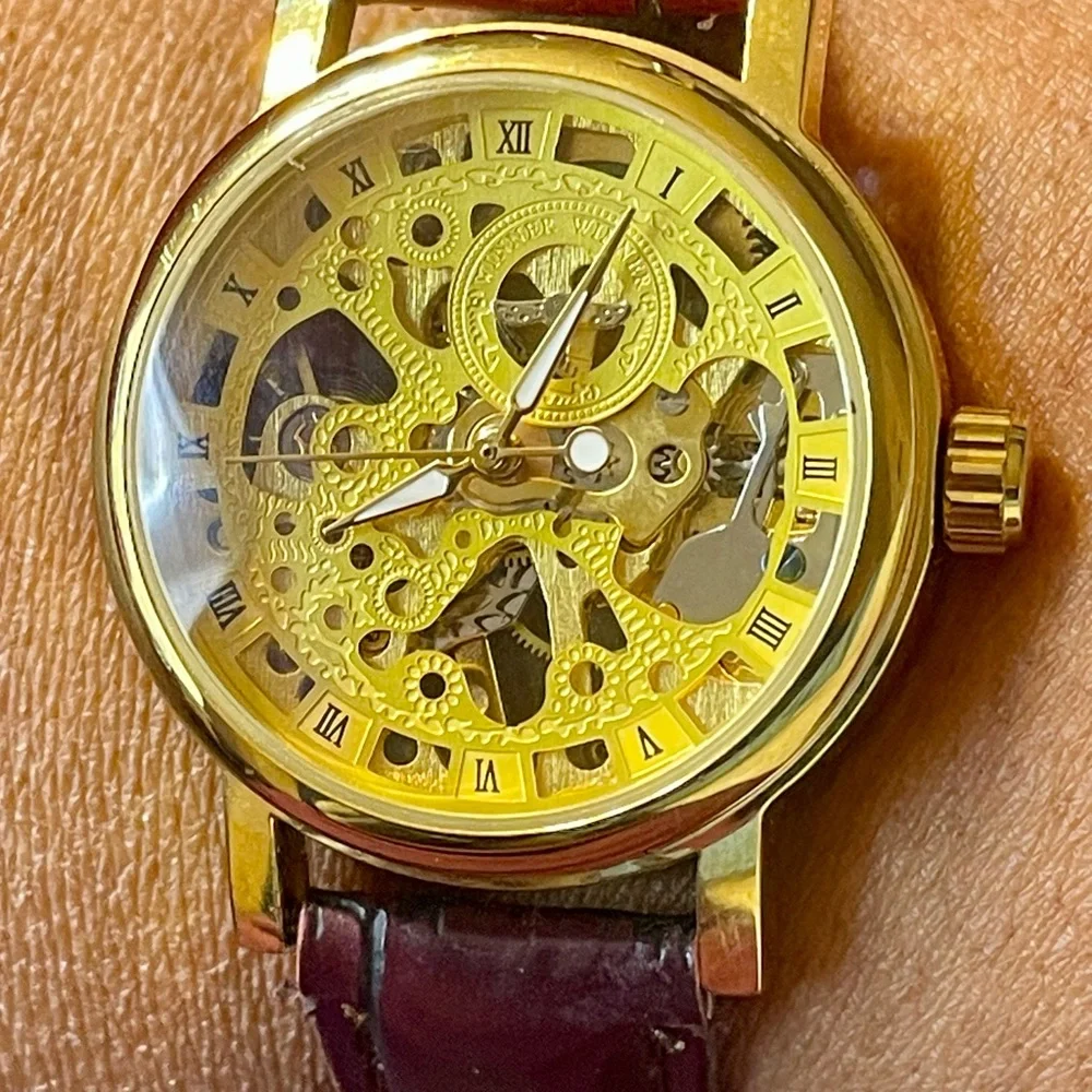 Gold Tone Skeleton Mechanical Watch with Burgundy Faux Textured Leather Strap